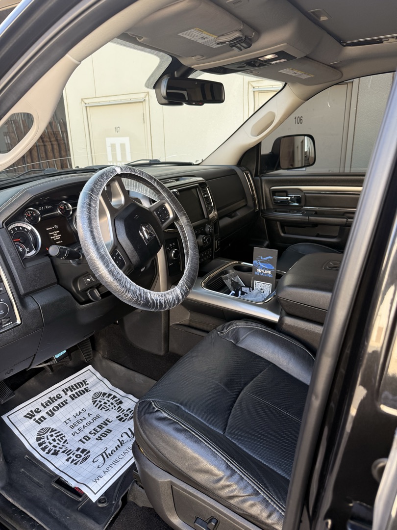 Ram truck interior after detail — Skyline Detailing business card