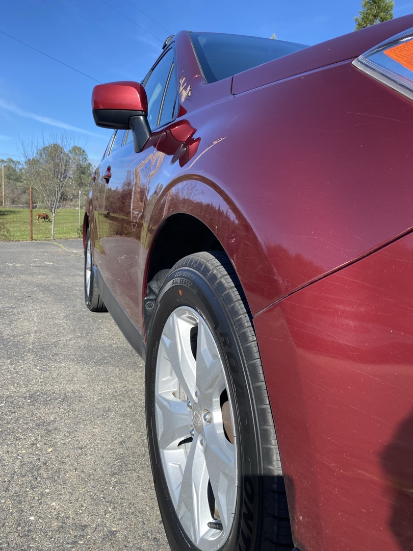 Deep gloss paint correction result on red vehicle